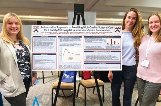 Margaret “Maggie” Erdman, MMS, PA-C, Katlin “Katie” Dlugosz, MMS, PA-C, and Lisa George, MS, stand with a poster that describes the HUP–Cedar surgical access initiative.